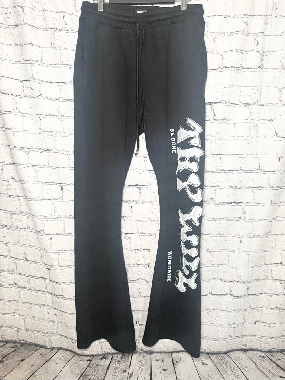 Novamen black graphic flare sweat pants. Size L